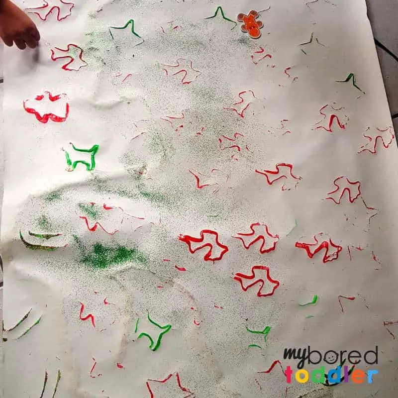 toddler painted christmas wrapping paper making it