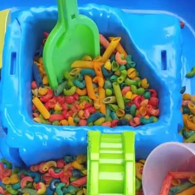 colored pasta sensory bin