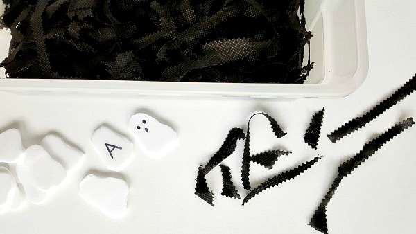 Halloween ghost sensory bin setup for toddler activity