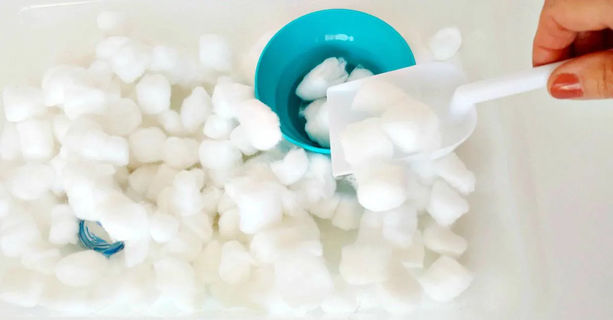 Winter sensory bin with cotton puffs for toddlers