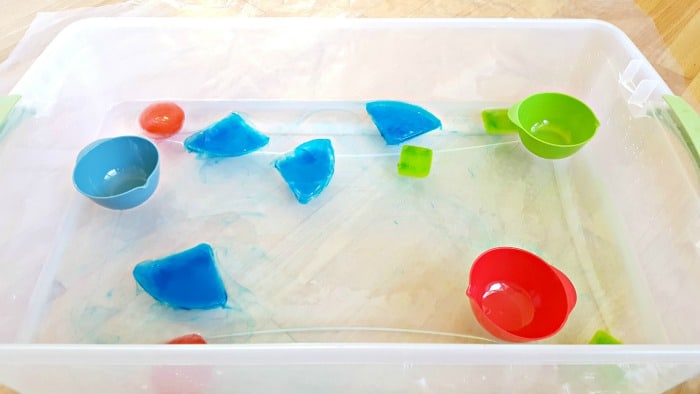 observe ice shapes colors filtering out into the water table