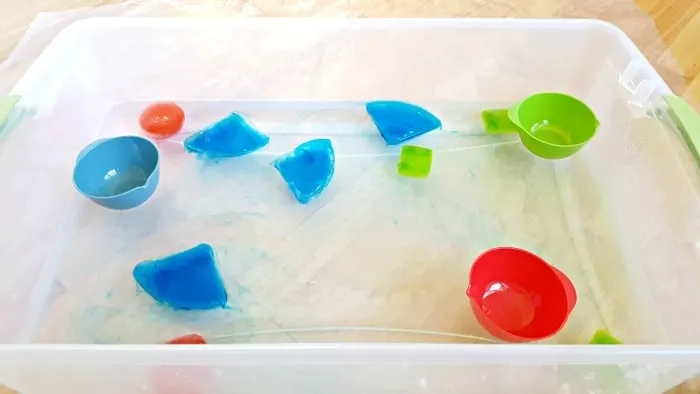 observe ice shapes colors filtering out into the water table