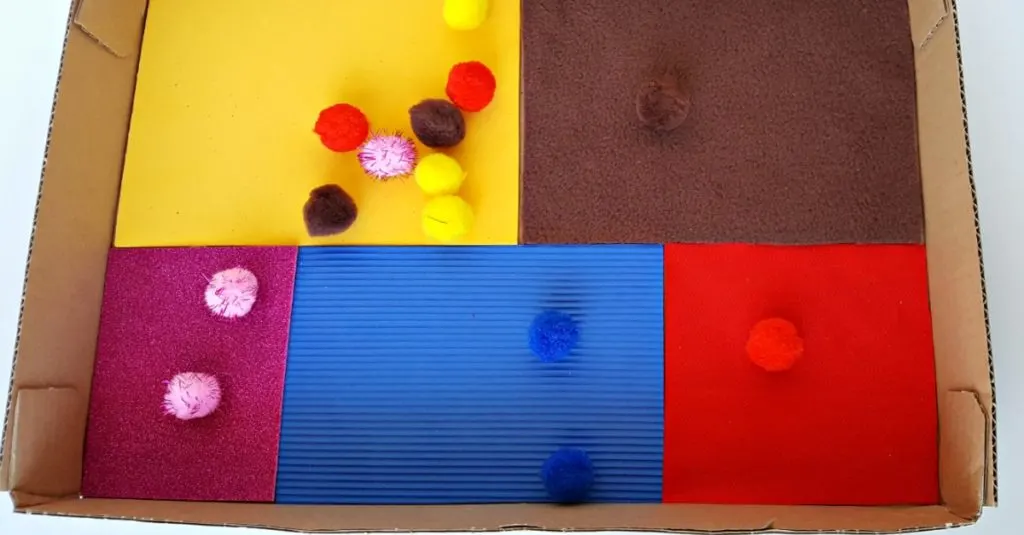 color matching toddler activity with a sensory box