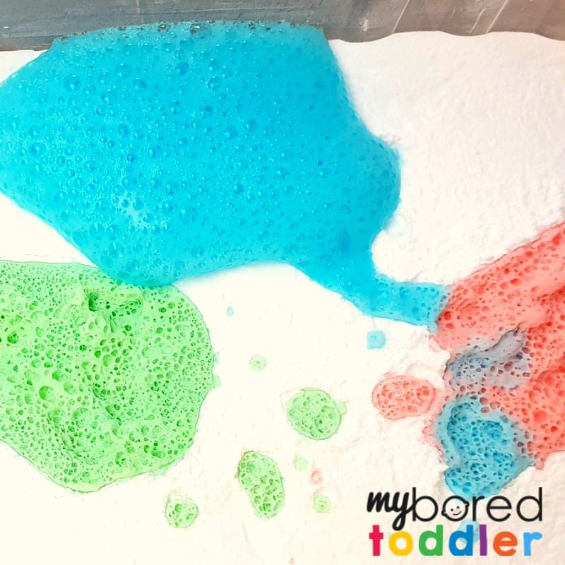 fizzing colorful sensory bin with vinegar and baking soda