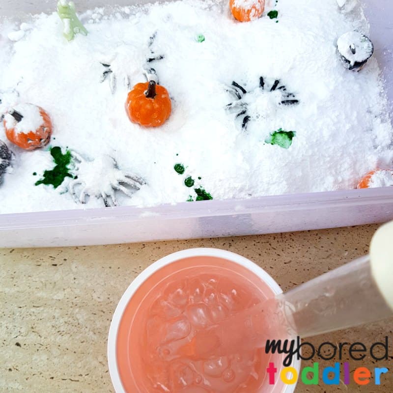 fizzing science Halloween sensory bin for toddlers pumpkins spiders