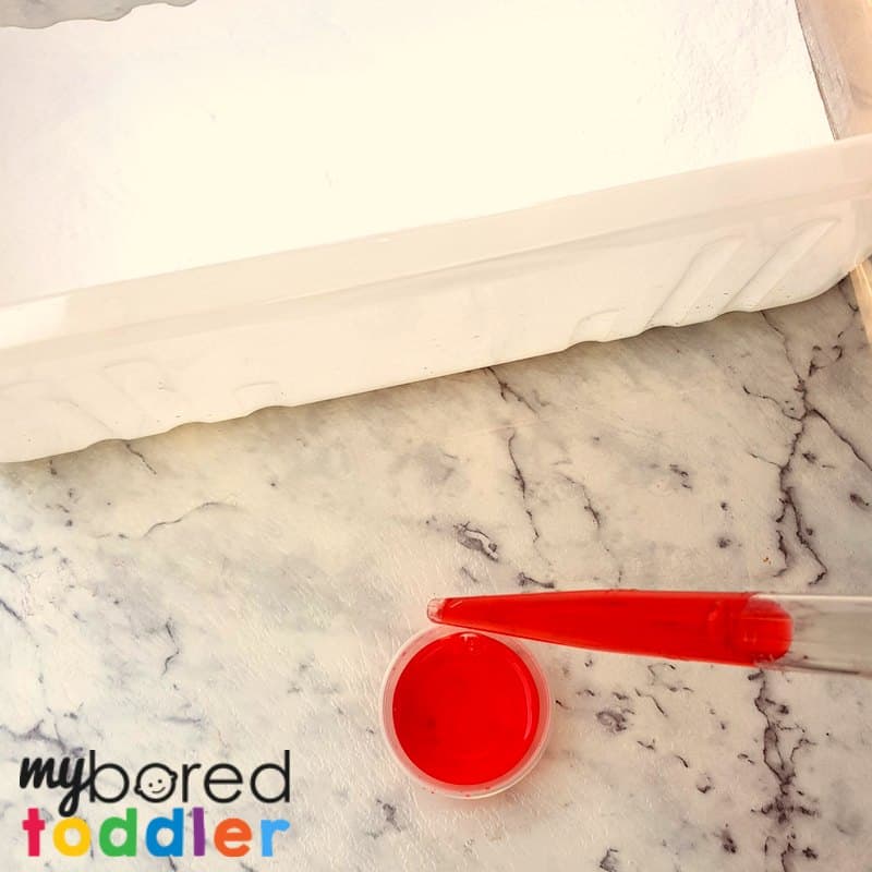 fizzing sensory bin toddlers preschoolers adding colored vinegar baking soda