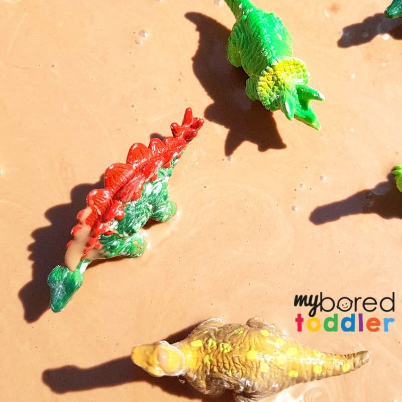 Taste safe muddy dinosaur sensory bin