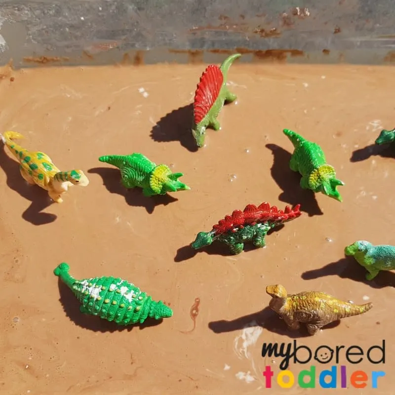 muddy dinosaur sensory bin with taste safe oobleck