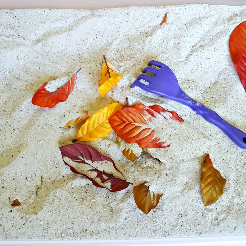 Raking leaves fall sandbox activity for toddlers