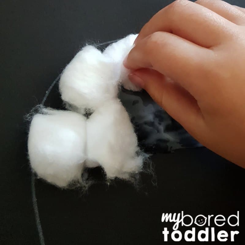 ghost cotton wool craft for toddlers adding cotton balls