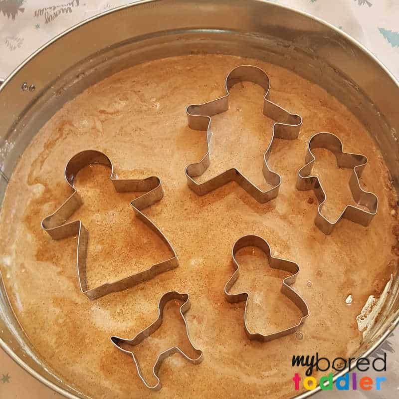 Gingerbread Oobleck - adding the gingerbread cookie cutters