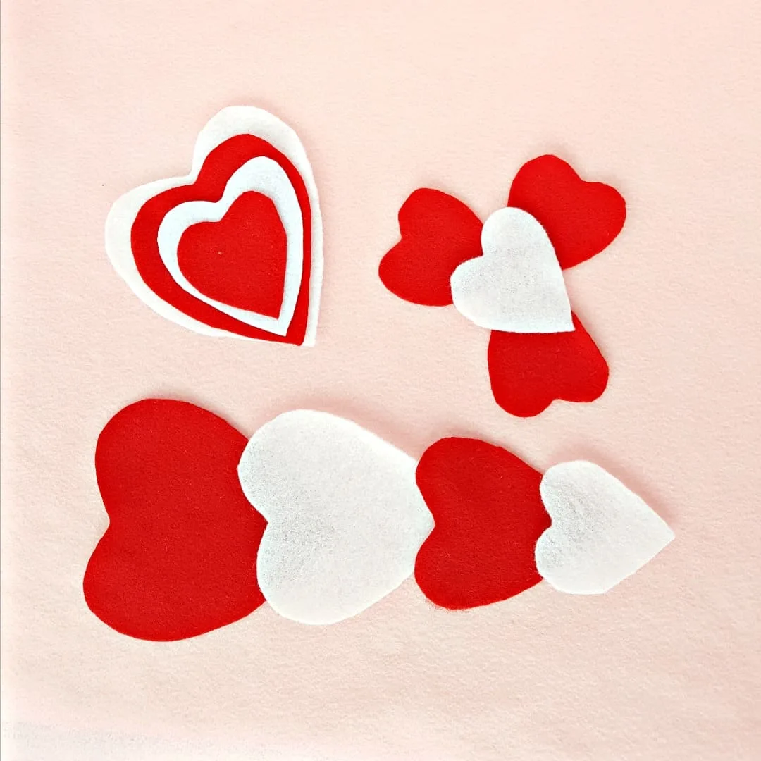 Toddler fine motor activity with felt heart shapes