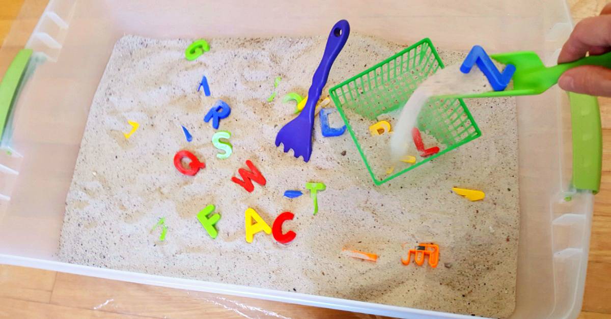 Toddler sandbox sensory and literacy activity