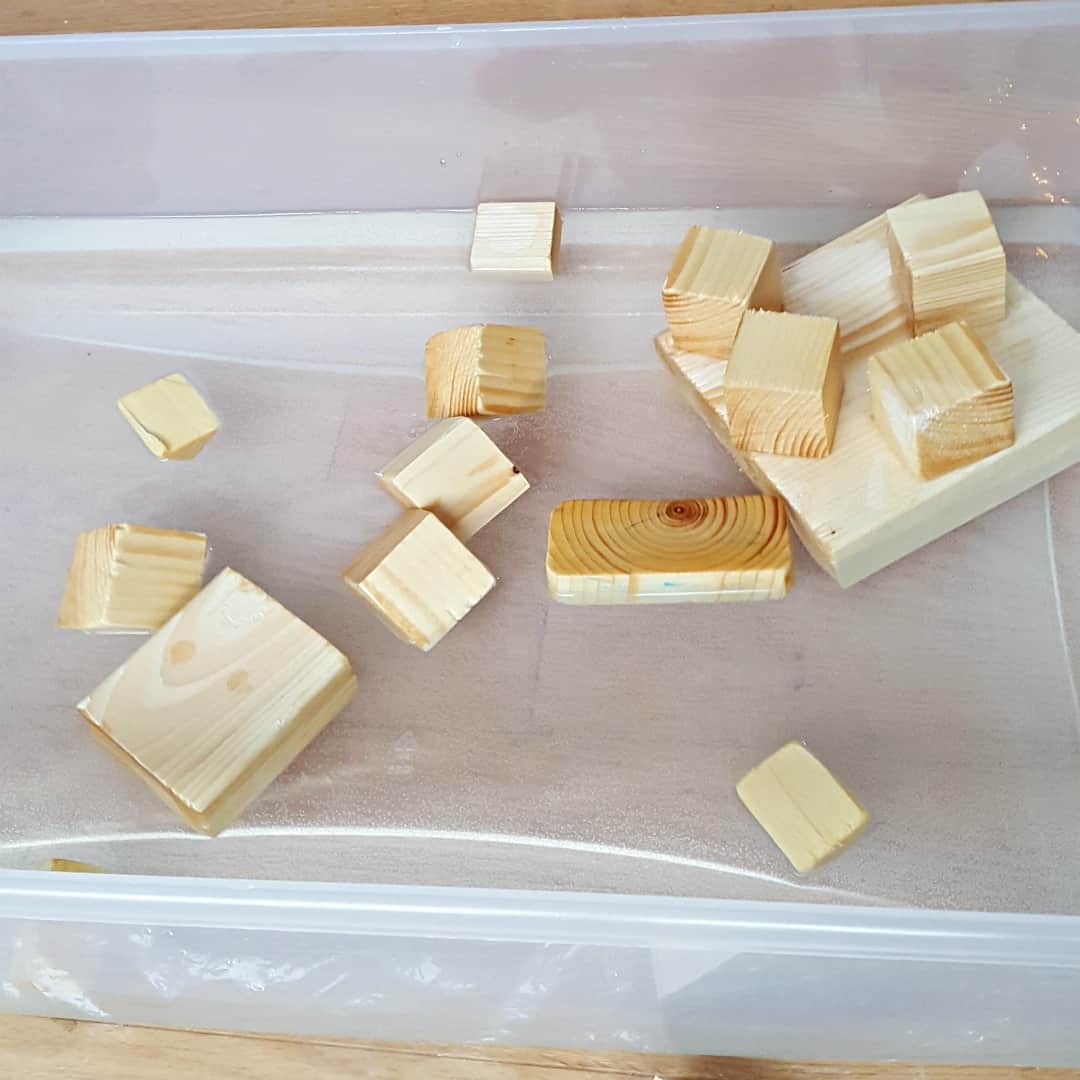 Toddler water play with wood blocks