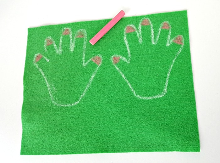 color nails with chalk on felt hand cutouts for the felt board - toddler handprint flower craft for spring