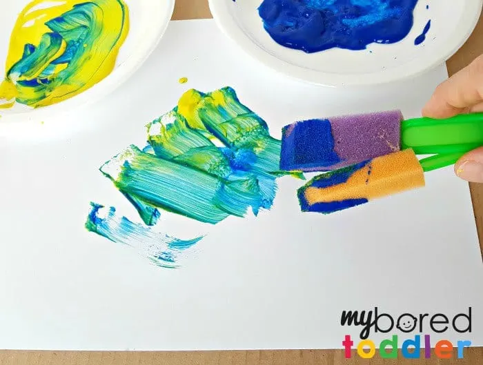 Mixing colors with two paint brushes at a time logo