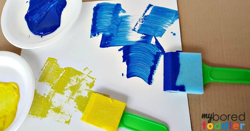 Painting with toddlers art activity using foam paint brushes