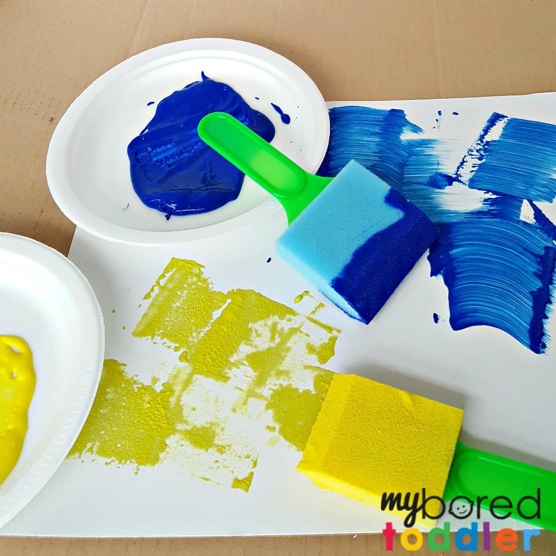 Toddler painting activity using foam brushes square no text