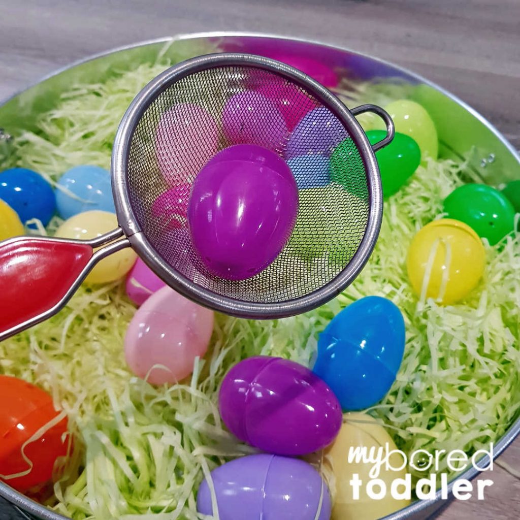 easter egg color hunt sensory bin using a scoop