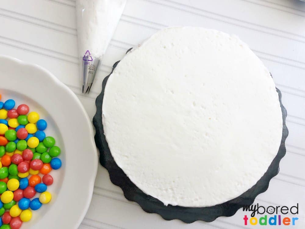 how to make an easy rainbow birthday cake using skittles step 1