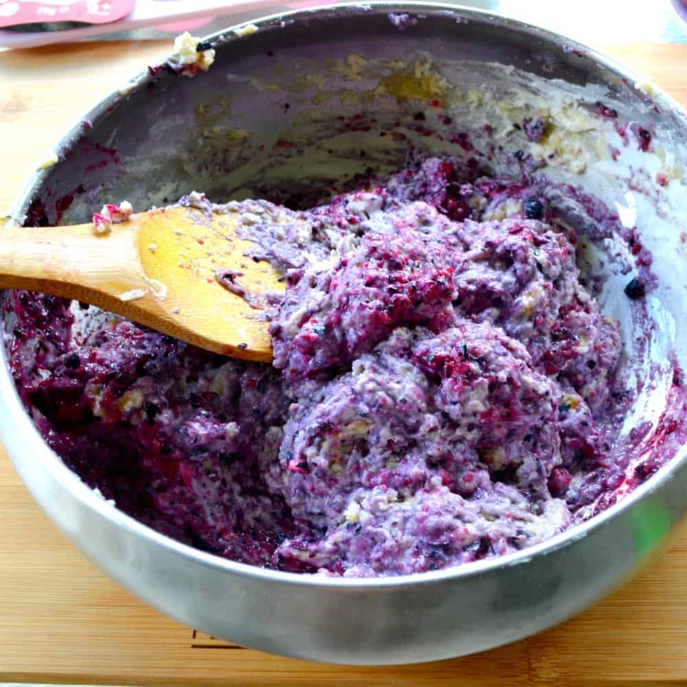 blueberry & strawberry yoghurt mini muffin recipe mixing the blueberries 