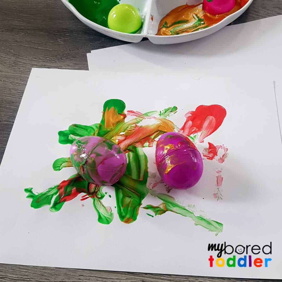 easter egg painting craft for toddlers rolling the eggs My Bored Toddler