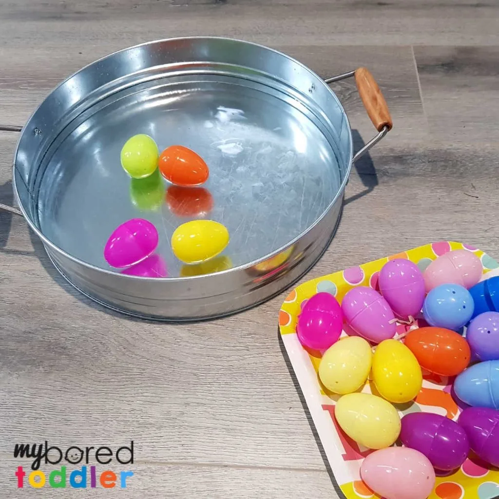 plastic easter egg water scooping sensory bin 2