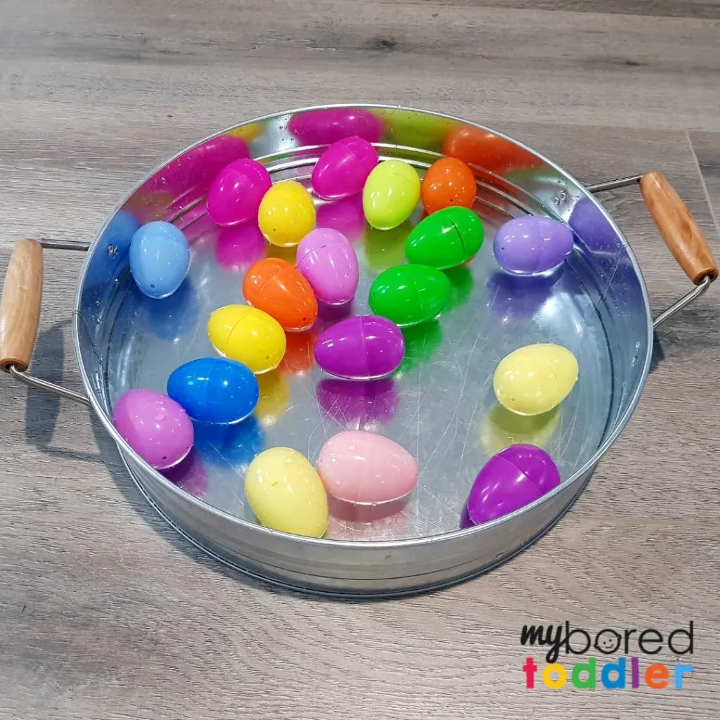 plastic easter egg water scooping sensory bin 3