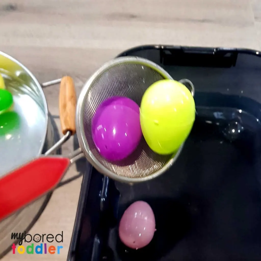 plastic easter egg water scooping sensory bin 5