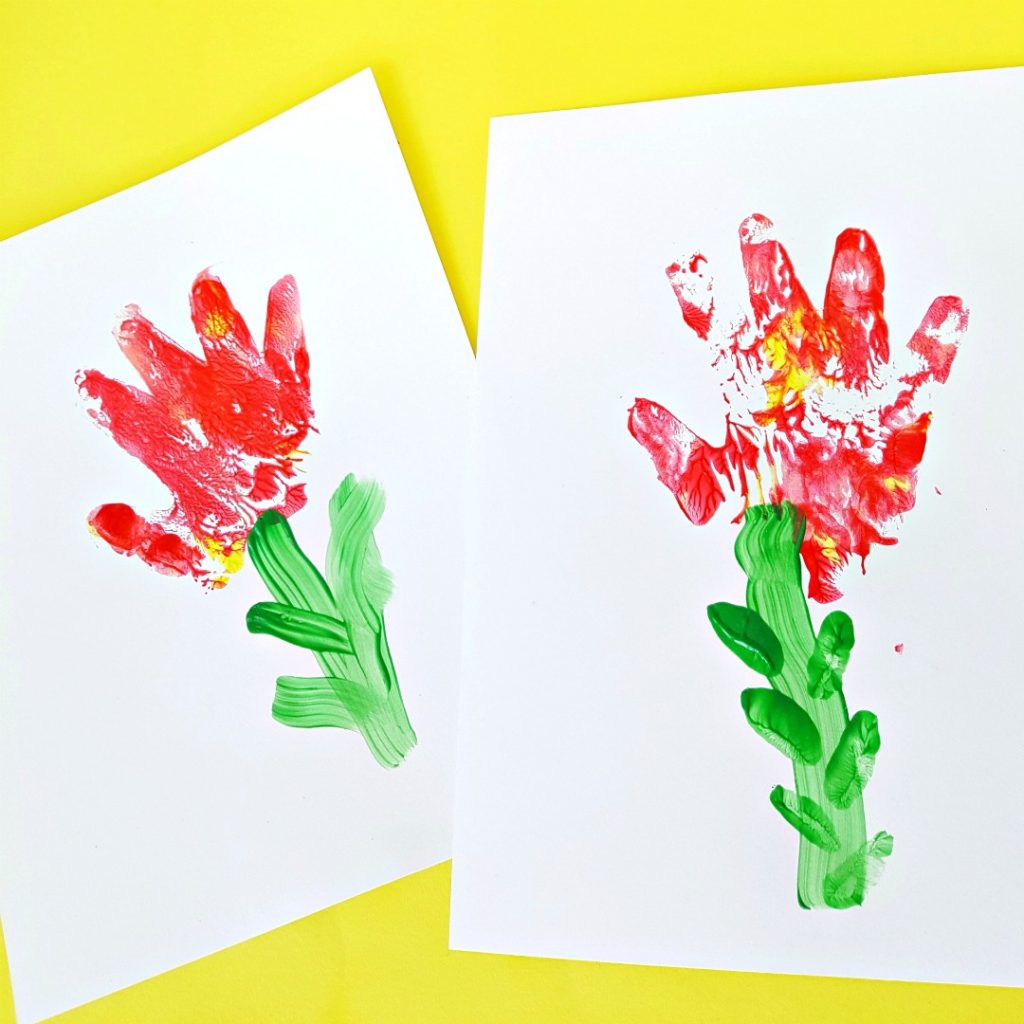 Painting with toddlers hand print flowers