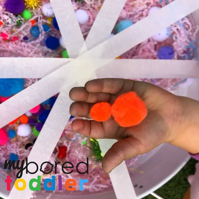 sensory pom pom rescue fine motor play idea for toddlers and preschoolers