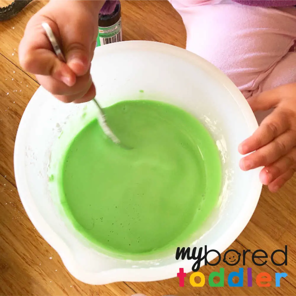making oobleck for crocodile sensory play for toddlers