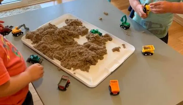 easy sand sensory bin for a construction theme