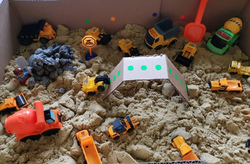 toddler construction sensory bin out of sand 