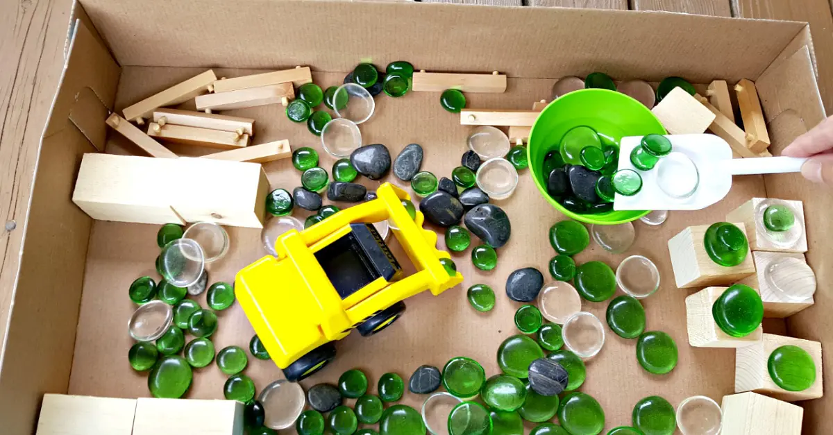 Construction zone cardboard box sensory play for toddlers