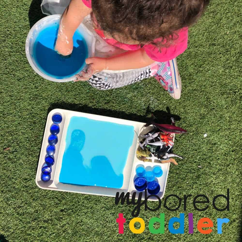 playing with color gradient oobleck - messy play for toddlers to do at home