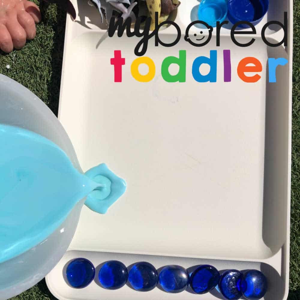 pouring oobleck into the tray