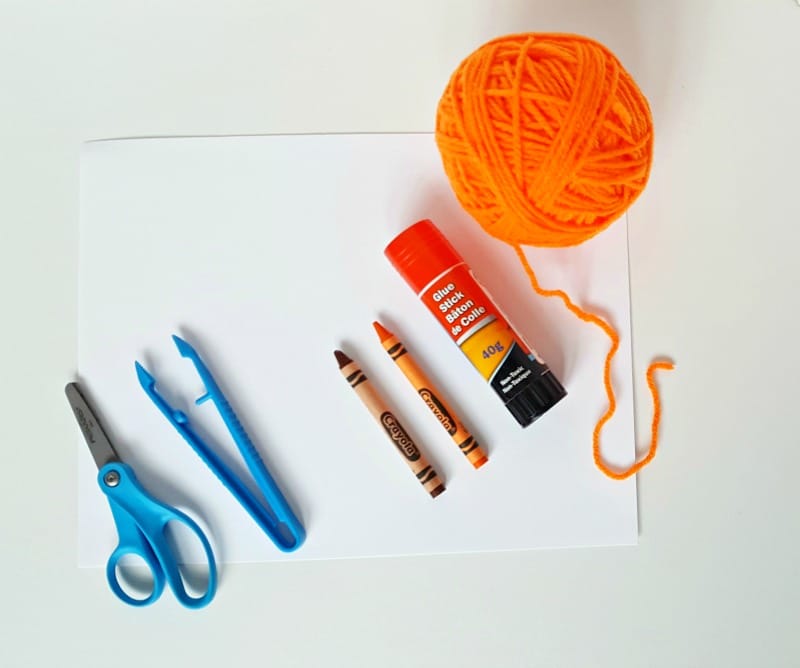Supplies for a yarn pumpkin craft