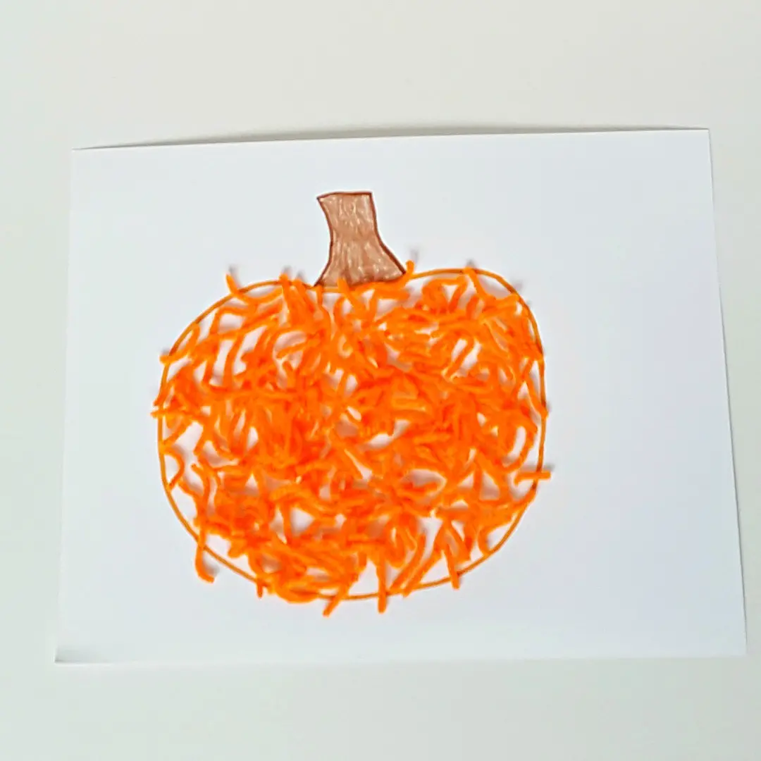 Yarn pumpkin craft for toddlers