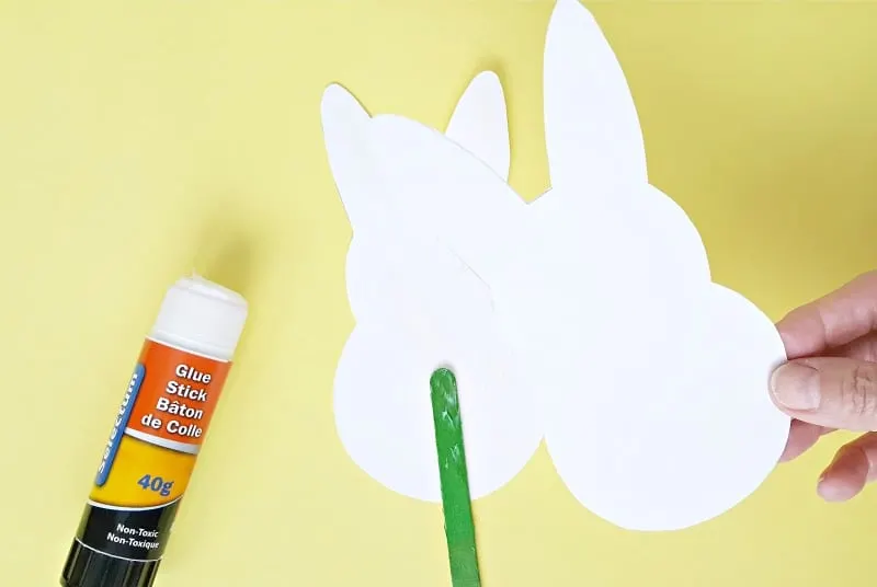 Glue two bunny cut outs together to make a puppet