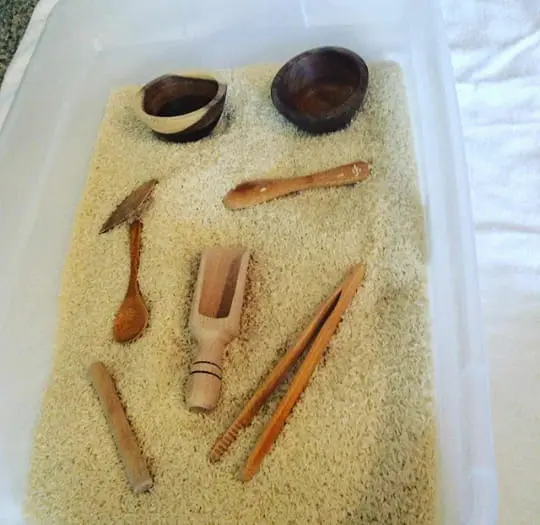 Melisssa - natural wood and rice sensory bin idea