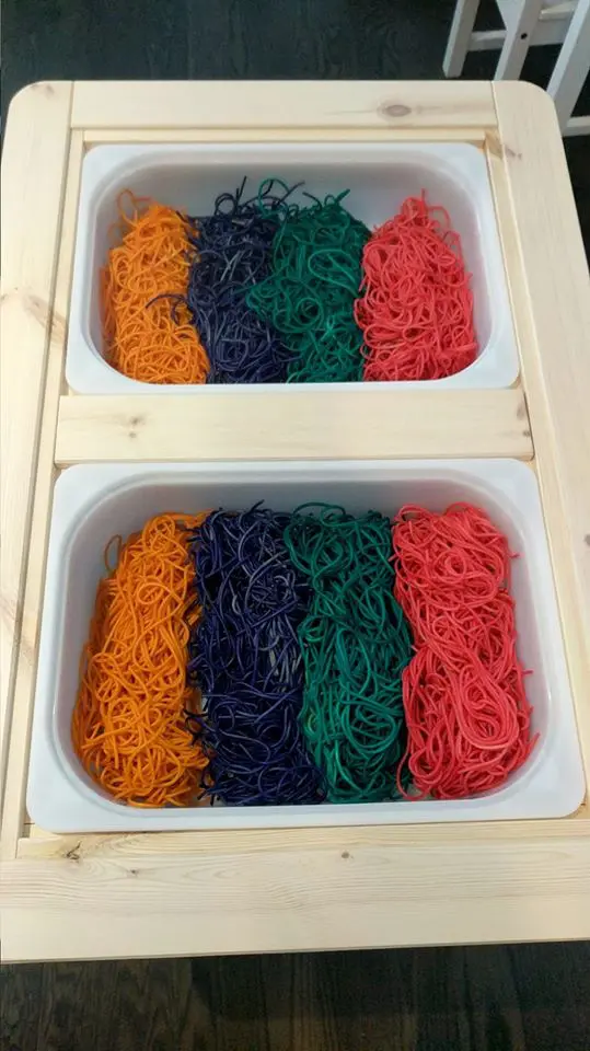colored spaghetti sensory bin rainbow