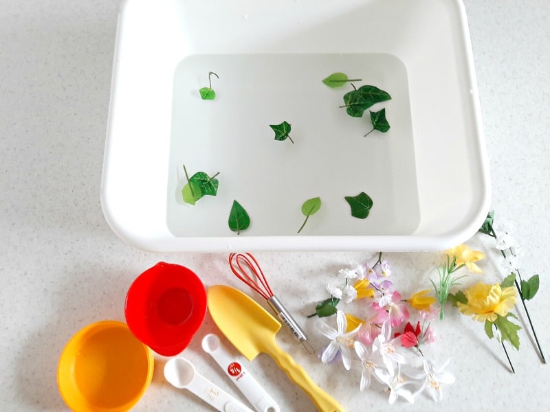 Toddler Water Play with Artificial Flowers