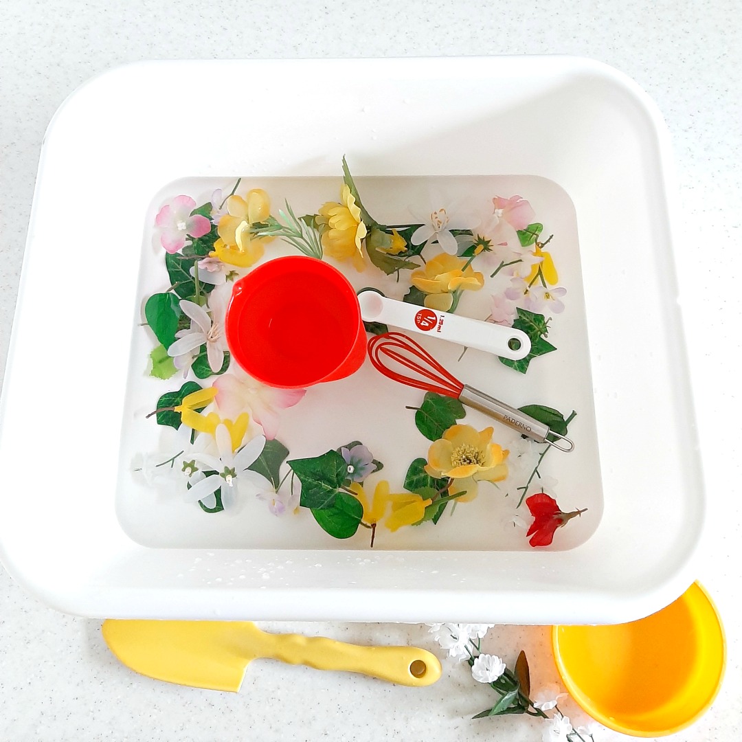 Toddler Water Play with Artificial Flowers