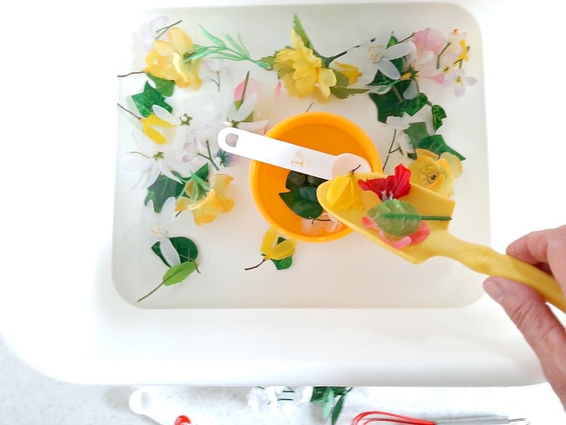 Toddler Water Play with Artificial Flowers