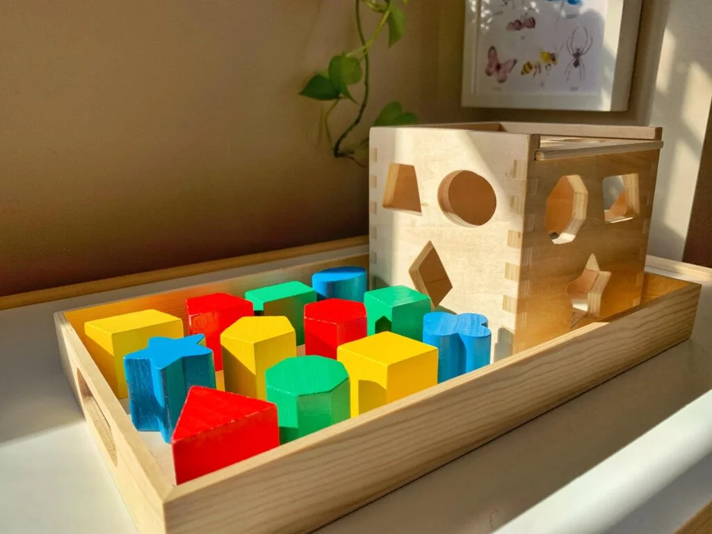 setting up a toy shelf with blocks for toddlers