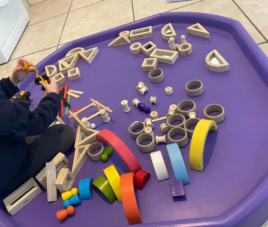 wooden blocks and rainbows on the tuff tray toddler activity 