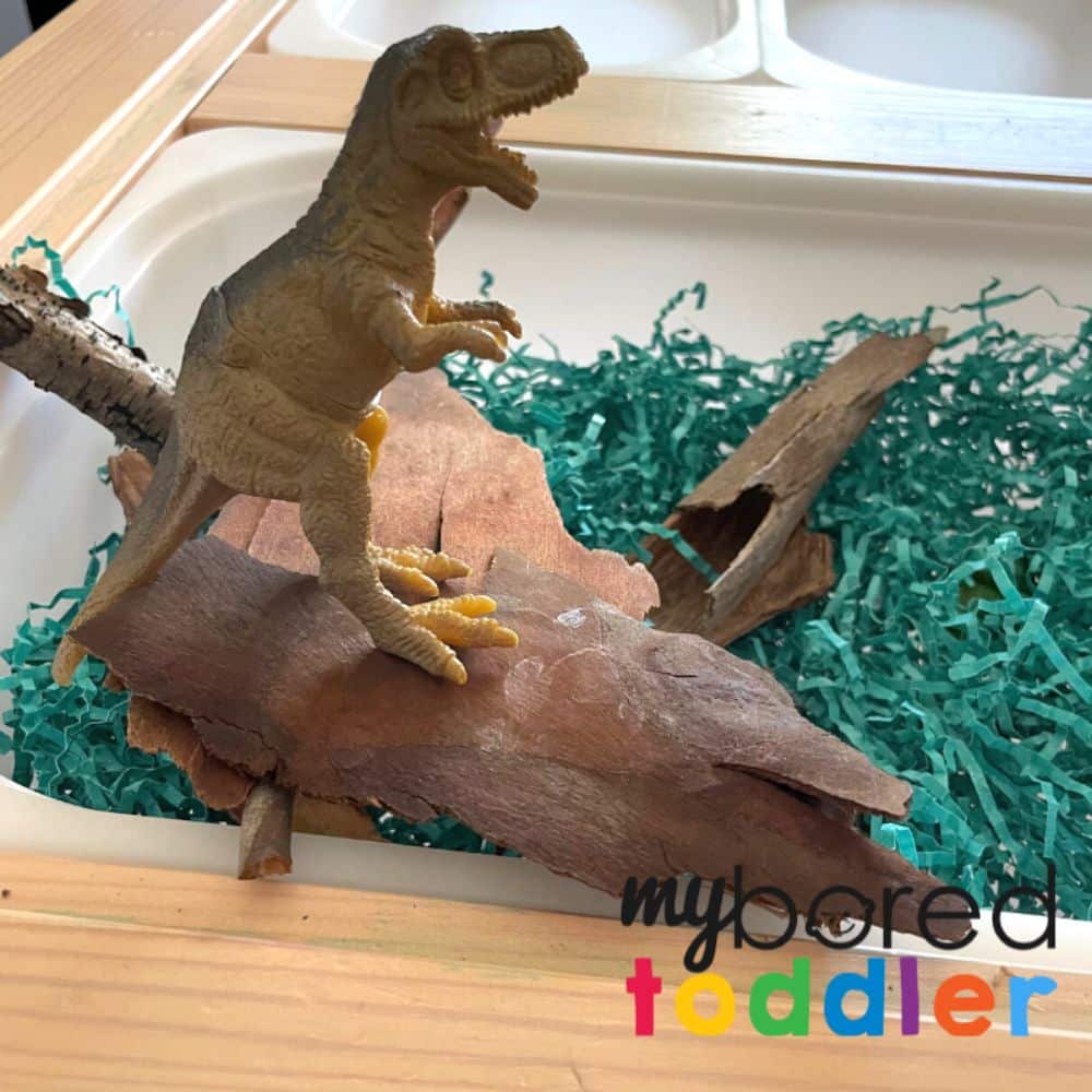 Dinosaur Sensory Bin from Shredded Paper