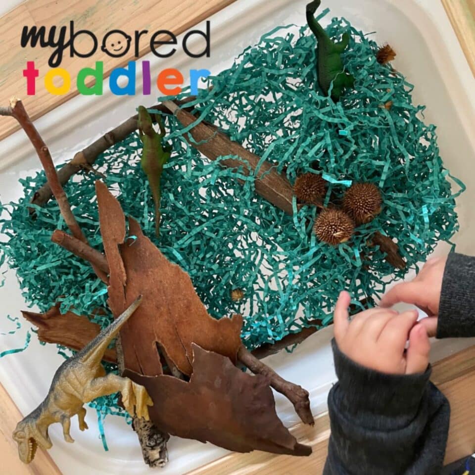 Dinosaur-Shredded Paper Sensory Bin - My Bored Toddler