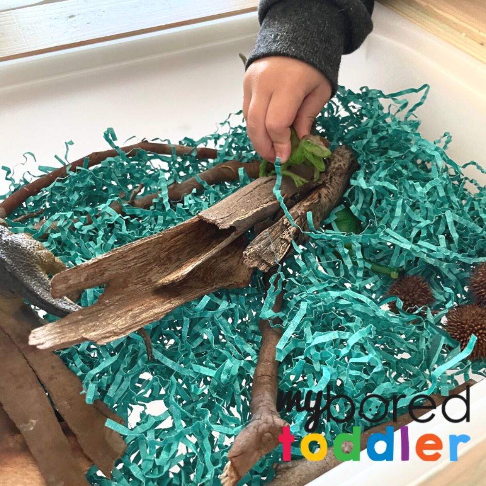 Dinosaur-Shredded Paper Sensory Bin - My Bored Toddler